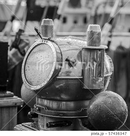 Reflection of a mast in an old ship compass, 57436347
