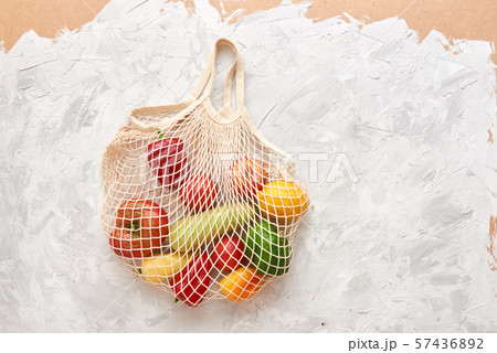 Eco friendly mesh bag with fruit and veggies. Top view. No plastic 57436892