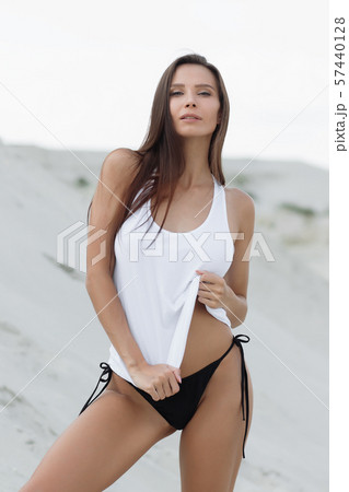 Pretty female in beachwear on nature background 57440128