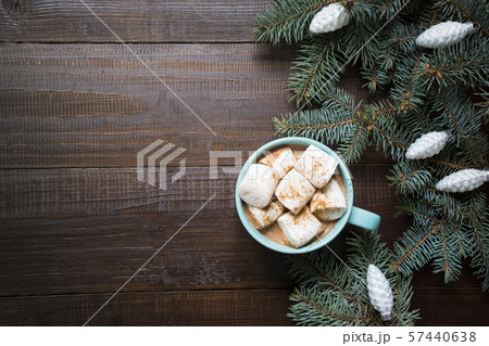 Christmas mug of coffee with marshmallow on dark wooden board. New Year. Top view and copy space. 57440638