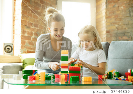 Teacher and little girl, or mom and daughter. Homeschooling concept 57444359