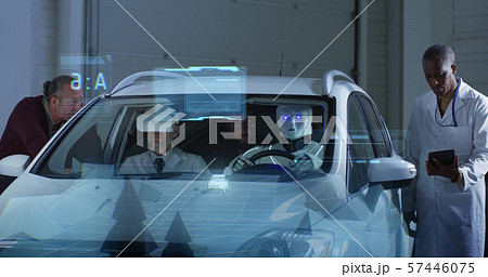 Scientists testing a car driving robot 57446075