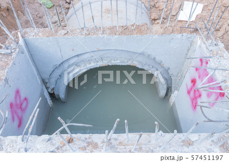 Concrete Drainage Pipe on a Construction Site, Concrete drainage tank on construction site, construction site at the road 57451197