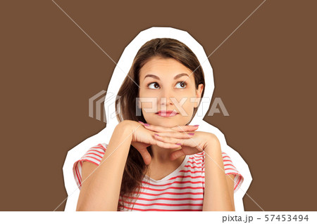 the laughing girl put her hands under her chin. the laughing girl put her hands under her chin. 57453494