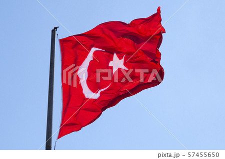 Very big red waving flag of Turkey with blue sky on the background. 57455650