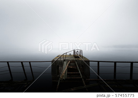 Damaged pier in the mist at morning 57455775