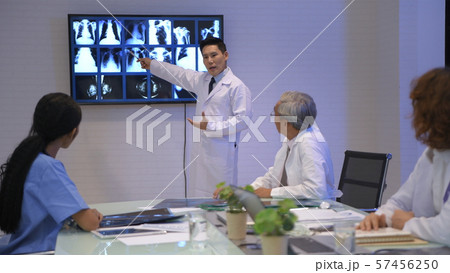 Medical concept. The young doctor is offering a Medical concept. The young doctor is offering a 57456250