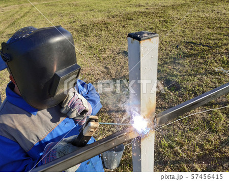 Welding of metal profile to pipes by master Welding of metal profile to pipes by master 57456415