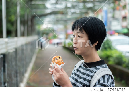 woman eat traditional Taiwanese snack woman eat traditional Taiwanese snack 57458742