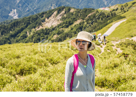 Asian mountain climbing woman Asian mountain climbing woman 57458779