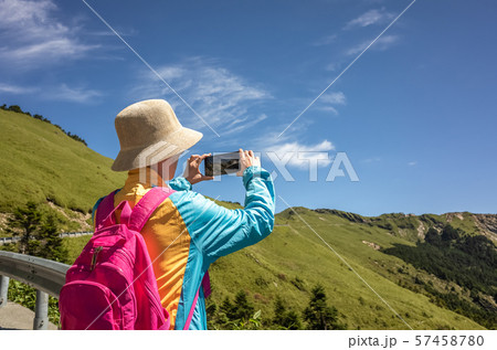 Asian climbing woman take pictures 57458780