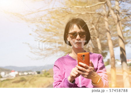 Asian woman using the smart phone Asian woman using the smart phone 57458788