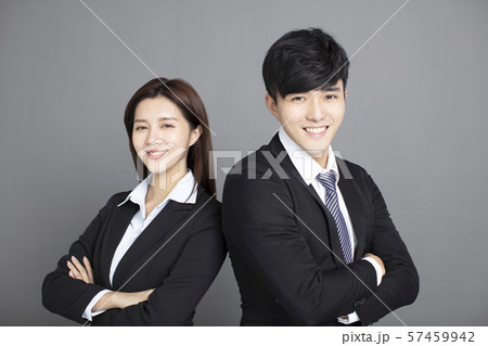 business man and woman standing back to back with business man and woman standing back to back with 57459942