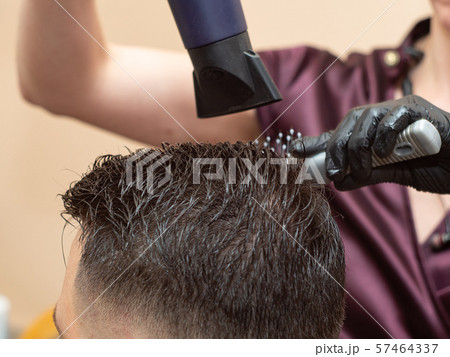 Female working with males hairdress in barbershop 57464337