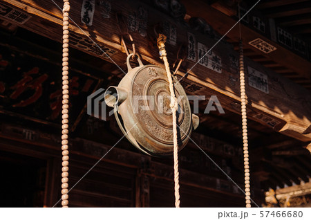 Japanese bronze shinto bell hanging at Shrine. 57466680