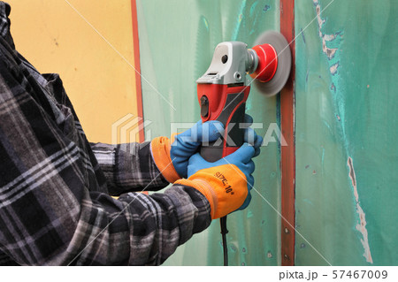 Old metal door repairing, rust and paint cleaning 57467009