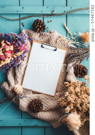 Blank paper and flower on background.  57467582