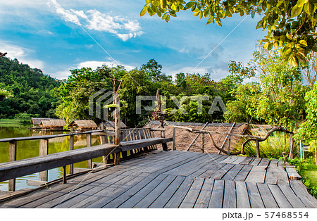 The wooden terrace and chairs on the reservoir. The wooden terrace and chairs on the reservoir. 57468554