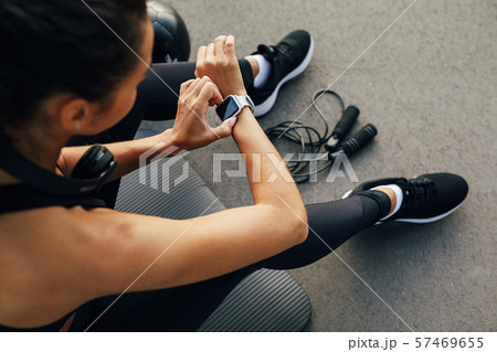 High angle view of female using smart watch High angle view of female using smart watch 57469655