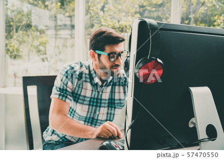 Good looking young business man working on the 57470550