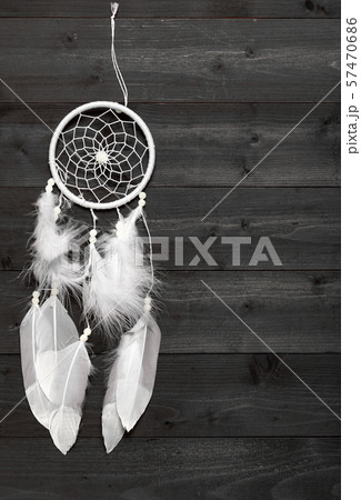 Black and white dream catcher on wood background Black and white dream catcher on wood background 57470686