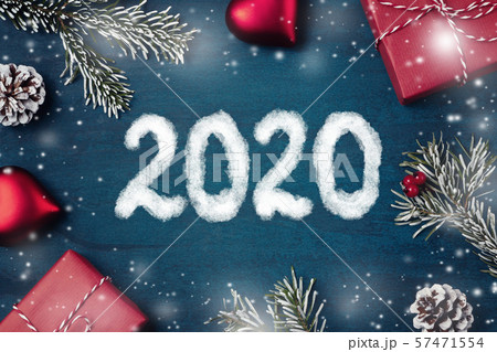 Christmas composition - gifts, decorations and inscription 2020 on a textured background, copy space 57471554