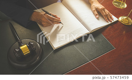 Judge gavel with Justice lawyers having team 57473459