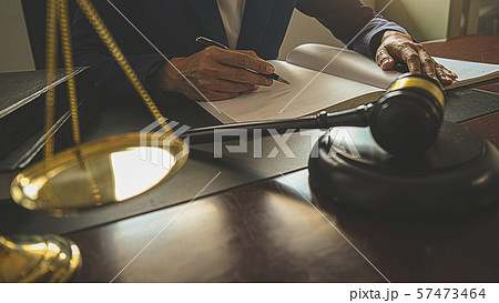 Judge gavel with Justice lawyers having team 57473464