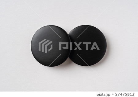 top view of black badge on grey background 57475912