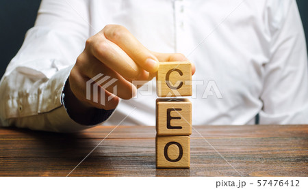 Wooden blocks with the word CEO and businessman. 57476412