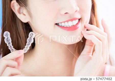 woman use invisible braces woman use invisible braces 57477402