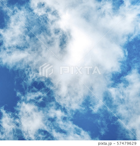 Abstract background, design template with copy space. Saturated blue sky with soft white clouds Abstract background, design template with copy space. Saturated blue sky with soft white clouds 57479629