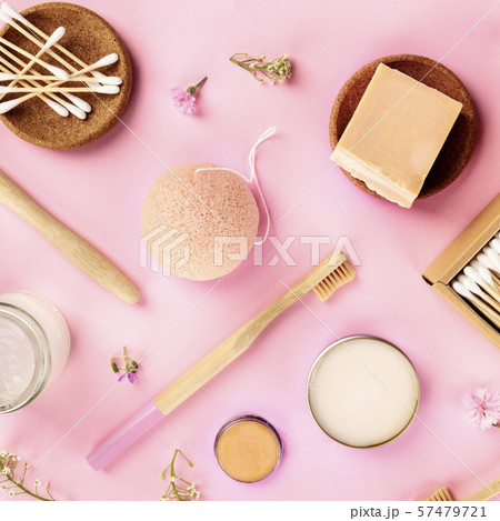 Plastic-free, zero waste cosmetics, flat lay on a pink background. Bamboo toothbrushes and cotton Plastic-free, zero waste cosmetics, flat lay on a pink background. Bamboo toothbrushes and cotton 57479721