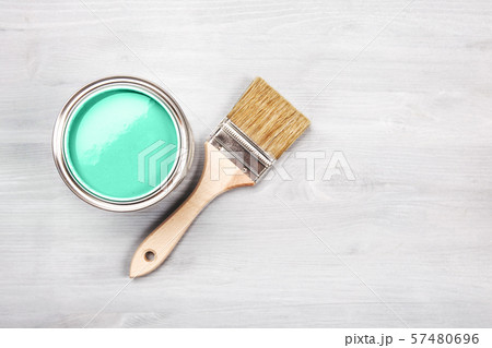 Paint brush on the can with green paint. Top view. Paint brush on the can with green paint. Top view. 57480696
