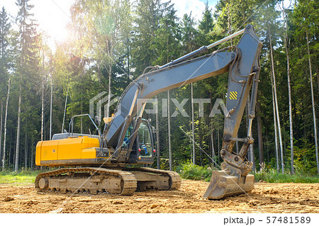 Heavy duty machinery backhoe excavator on site 57481589