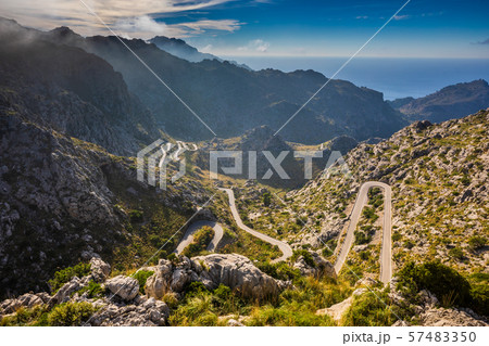 Wide view of Coll dels Reis road, sea behind 57483350