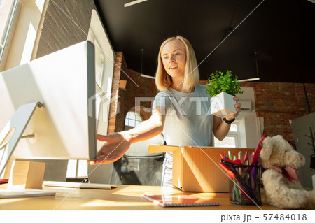 A young businesswoman moving in office, getting new work place 57484018