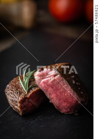 rare grilled tenderloin beef steak on cutting 57486921