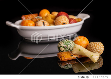 Japan assortment snacks isolated on black glass Japan assortment snacks isolated on black glass 57487629