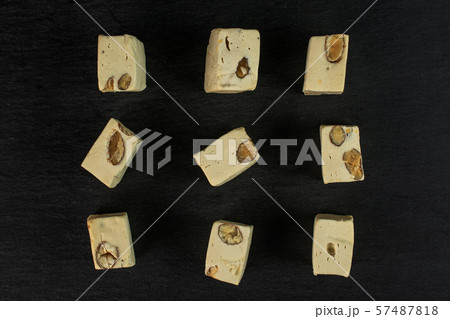 White nougat candy on grey stone White nougat candy on grey stone 57487818