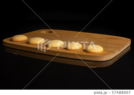 Sweet sponge biscuit isolated on black glass 57488007