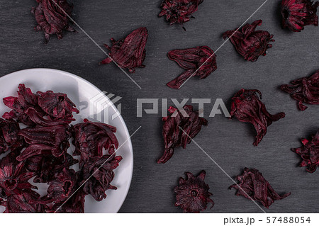Candied hibiscus on grey stone Candied hibiscus on grey stone 57488054