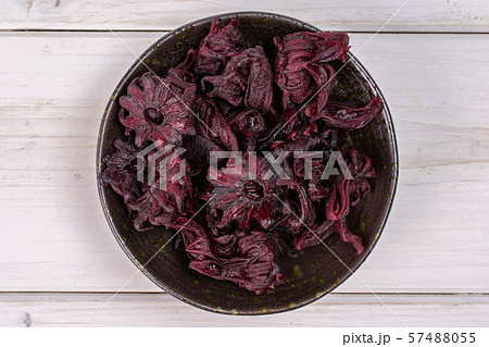 Candied hibiscus on grey wood Candied hibiscus on grey wood 57488055