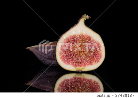 Fresh fig fruit isolated on black glass 57488137