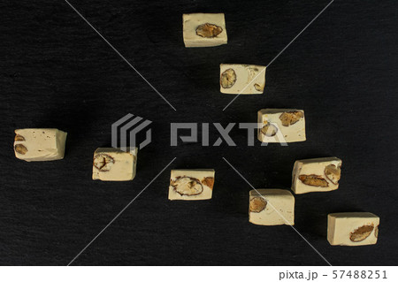 White nougat candy on grey stone White nougat candy on grey stone 57488251