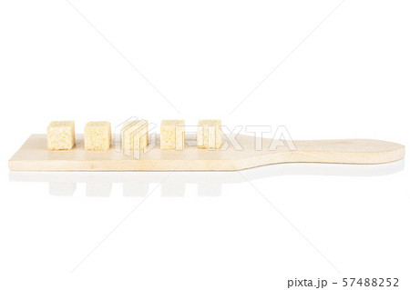 Brown sugar cube isolated on white Brown sugar cube isolated on white 57488252