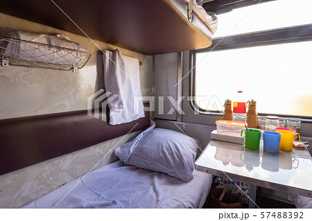 Empty bottom bunk in a reserved seat carriage and Empty bottom bunk in a reserved seat carriage and 57488392