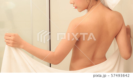 Beautiful slim body of woman wrapped with towel. Beautiful slim body of woman wrapped with towel. 57493642