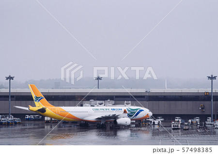 Airplane under raining bad weather at Tokyo Narita Airplane under raining bad weather at Tokyo Narita 57498385