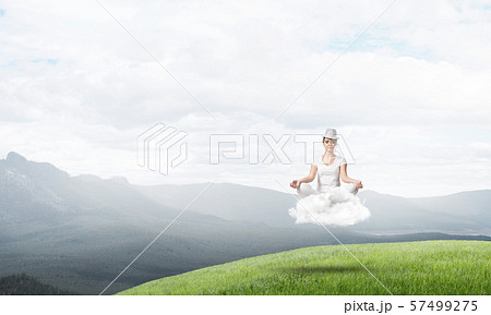 Young woman keeping mind conscious. 57499275